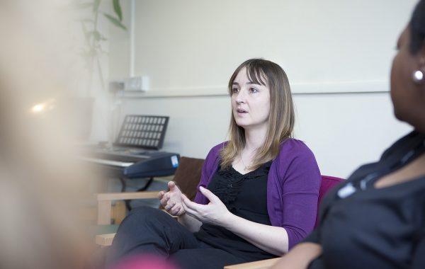 A woman talking in a psychological therapy session