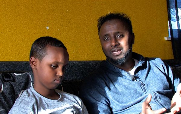 A boy and his father in the short film Overcoming Barriers
