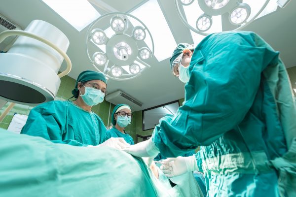 NHS workers in face masks having a meeting