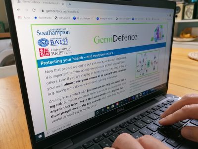 A laptop screen showing the Germ Defence website
