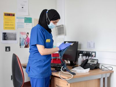 An NHS worker in a face mask