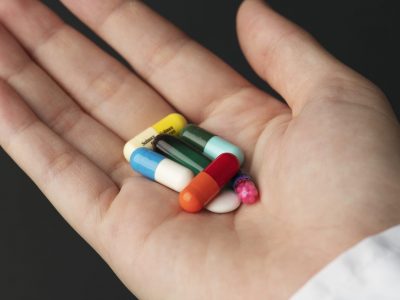 A selection of pills in a person's hand