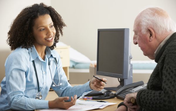 A GP talks to a patient