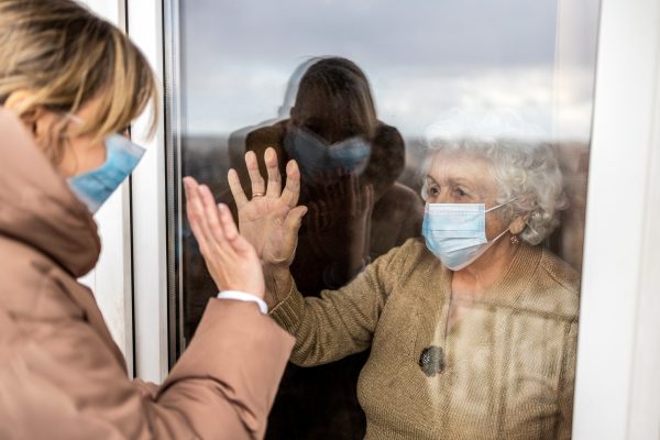 NHS workers in face masks having a meeting