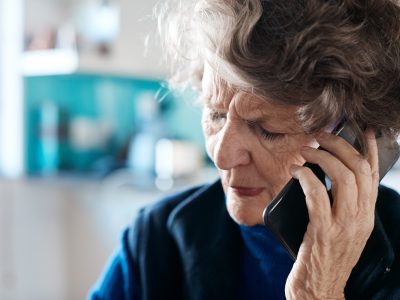 An older person on the phone
