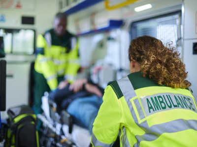 Ambulance crew attending to a patient in an ambulance