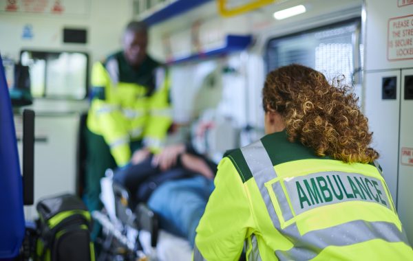 Ambulance crew attending to a patient in an ambulance