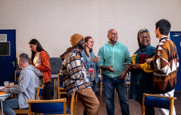 A group of adults talking in a community setting